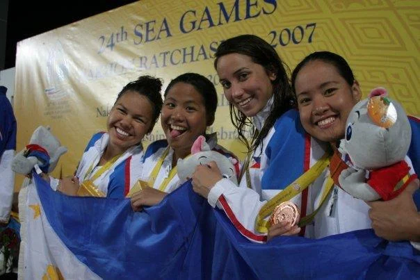 Posing on the awards podium (farthest left) after winning a bronze medal at the 2007 SEA Games in Thailand