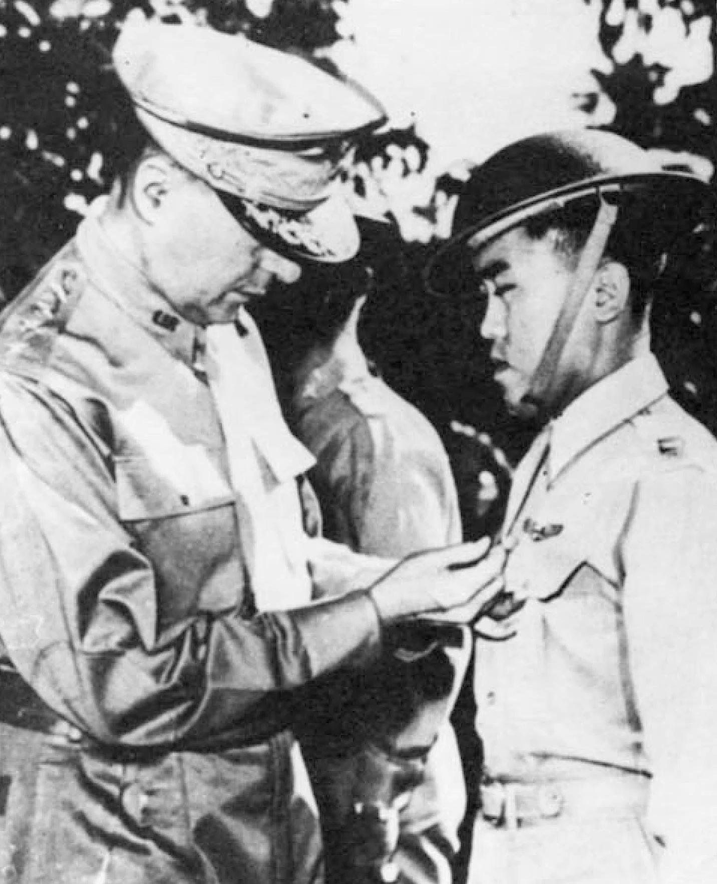 Gen. MacArthur awards the U.S. Distinguished Service Cross to Villamor for his heroic action in an aerial combat against superior Japanese zeros. This is one of 13 medals for valor Villamor earned in WWII.