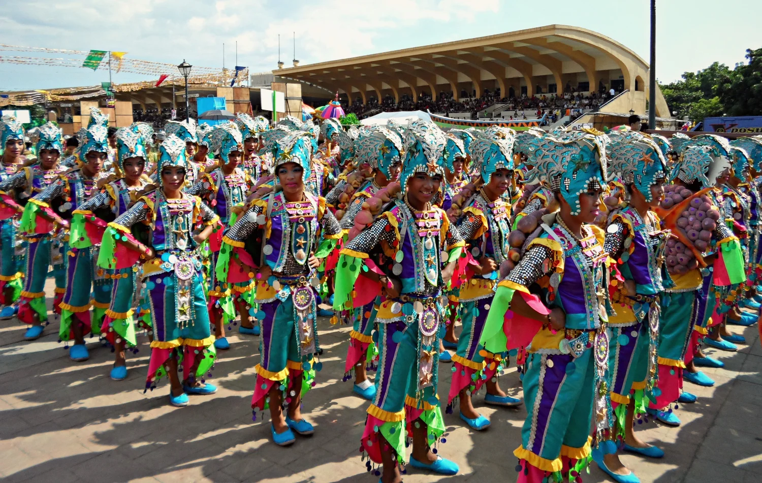 Intricately costumed young men and women from the Pasaka Festival in Tanauan, Leyte add to the explosion of color at Quirino Grandstand. (Photo by Migs Bassig)