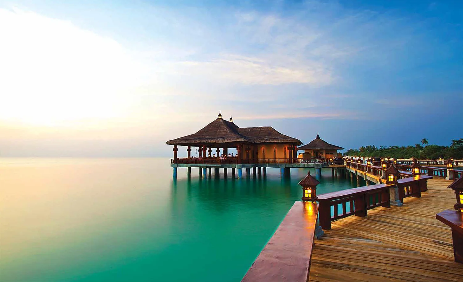 One island, seven destinations: Dinner in Italy then breakfast in Phuket? You bet. Seven hospitality villages at the Balesin Island Club offer amenities ranging from rooftop whirlpools in Mykonos Village to garden cabanas in Phuket Village. Here, stilt villas at the Bali village above the tranquil Lamon Bay (Photo by Matthew Acred).