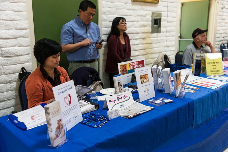 Angela Japson Encarnacion (left) of Always Best Care-Peninsula at a senior outreach event. (Photo by Voltaire Yap)