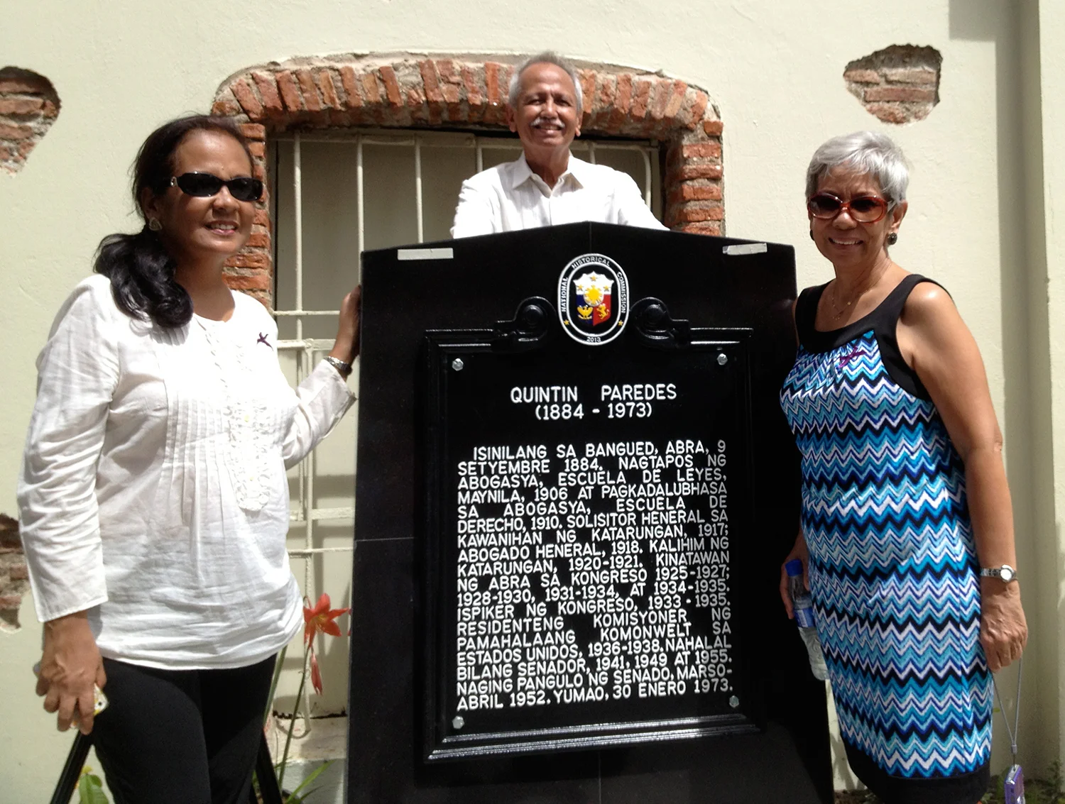 The author (right), her sister Lory Tangonan and brother Jesse Paredes pose beside the historical marker at their ancestral home in Bangued, Abra.  (Photo courtesy of Paulynn and Gloria Sicam)