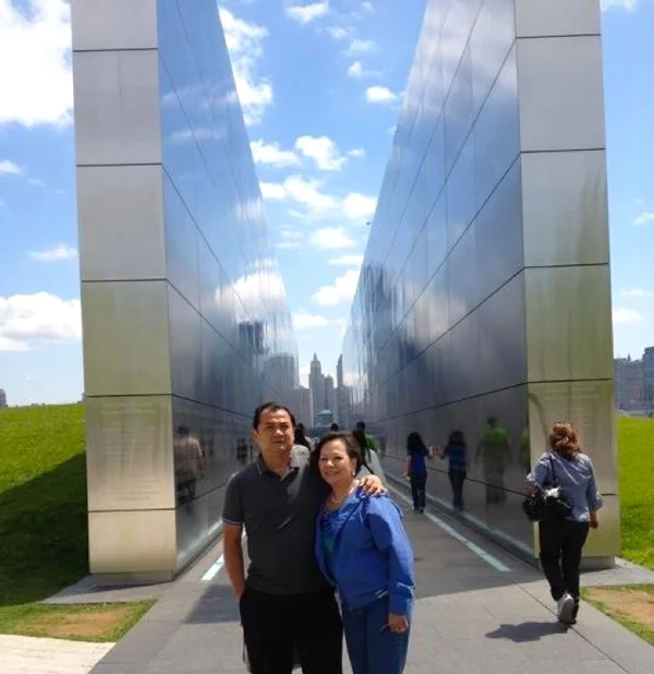 Frank and Vivian Cruz at Liberty State Park in Jersey City, right across from where the World Trade Center towers once stood. The memorial has all the names of the victims etched in stone.