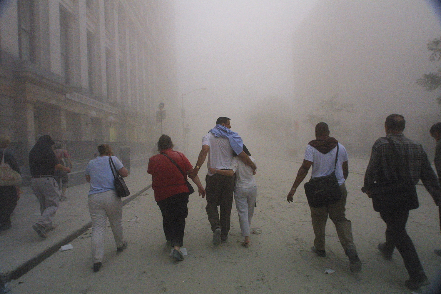 New Yorkers walk on the ash-filled streets after the World Trade Center towers fell  (Source: Getty Images)    