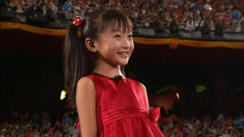 Did she or didn't she lip-synch? There was a great uproar when word got out that another less attractive girl's voice was used to sing the Chinese national anthem while this more photogenic girl, Lin Miaoke, was the face the world saw. But so what? 1. It's not like either girl was a bonafide entertainer on whose reputation the show was built on; and 2. Hollywood does it all the time. Michael Jackson probably wouldn't have...had they stuck with him for Los Angeles 1984 Games (Source: NBC)