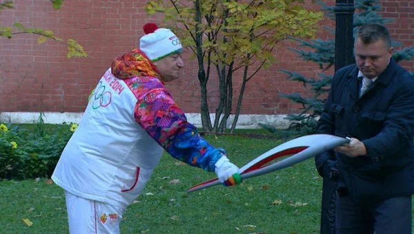 A No-No per Olympic protocol. The Sochi 2014 Torch Relay has been plagued with flameout problems. After only the first day on Russian soil, the second runner's flame went out. And since there was no relay escort around, Shavarsh Karapetyan, an Armenian swimmer, sought the aid of a security man standing by who just happened to have a lighter. (This happened within the Kremlin grounds.) Per Olympic protocol, the flame is supposed to be relit from the miner's lamps that carry the “sacred” Olympic flame from Olympia, Greece. (Source: AP)