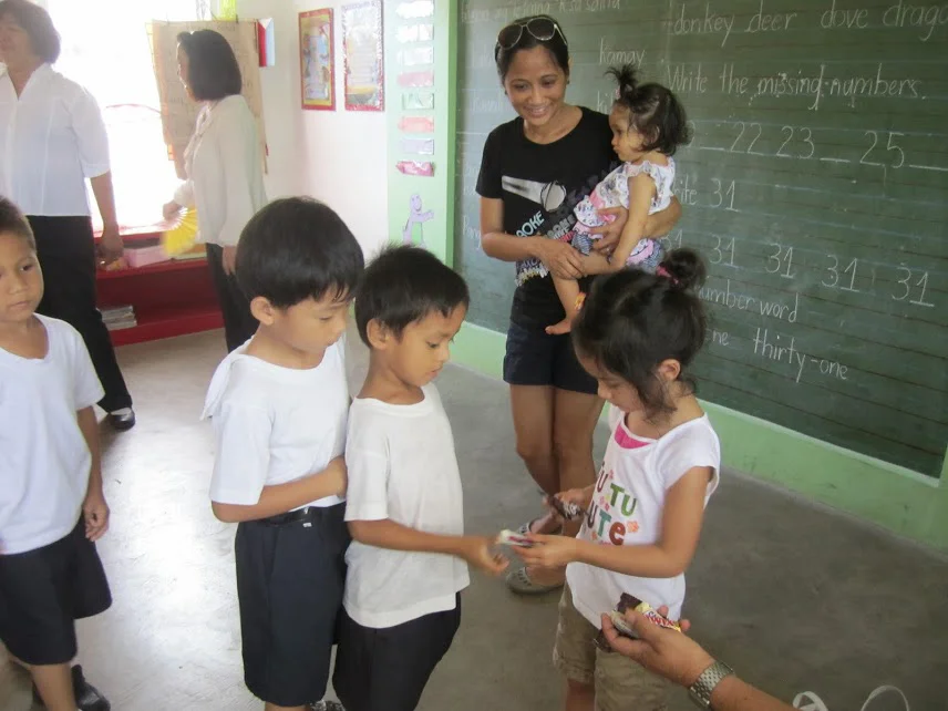 Every time we bring the girls, we take them to a local school we support through AGAPP (Aklat, Gabay, Aruga tungo sa Pag-angat at Pag-asa). One of my favorite things about this is the sharing. Local kids often sing a song and my daughter will do the same - great insight into each others worlds! (Photo courtesy of Regina Manzana-Sawhney)