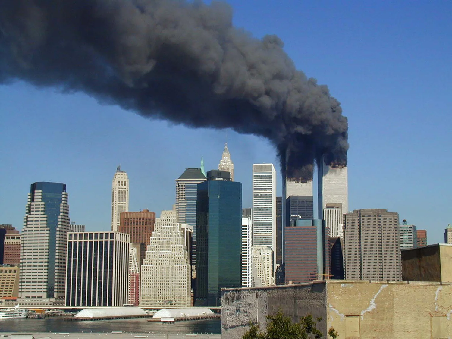 The World Trade Center, after it was struck by terrorists on September 11, 2001 (Photo by Michael Foran/Wikipedia/ Creative Commons license)