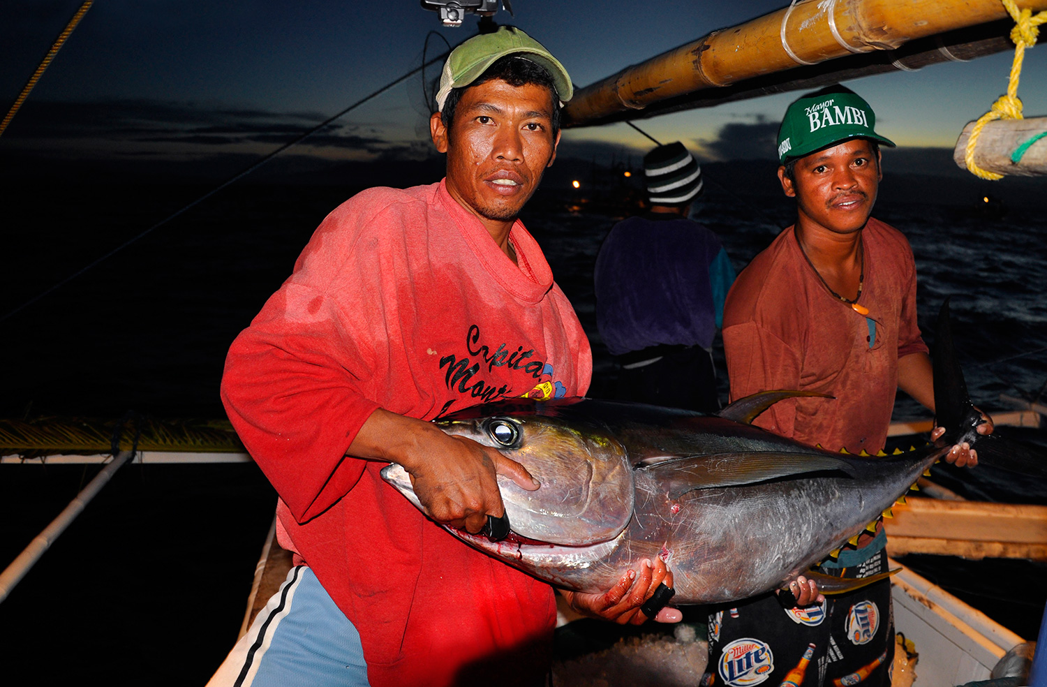 Tuna fishermen and their prized catch (Photo by Gregg Yan / WWF)