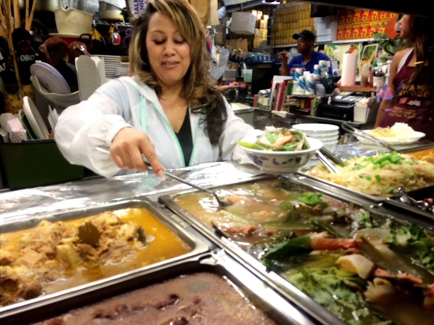 Joy Apostol Mori serves the renowned salmon sinigang (Photo by Elias M. Ferrer)
