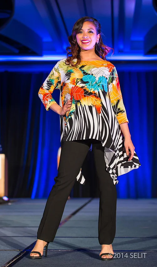 Multi-color leaf and zebra print boat neck handkerchief hem tunic top paired with black straight-legged pants (Photo by Selit Rapadas / UNIT ONE Photography Studio )