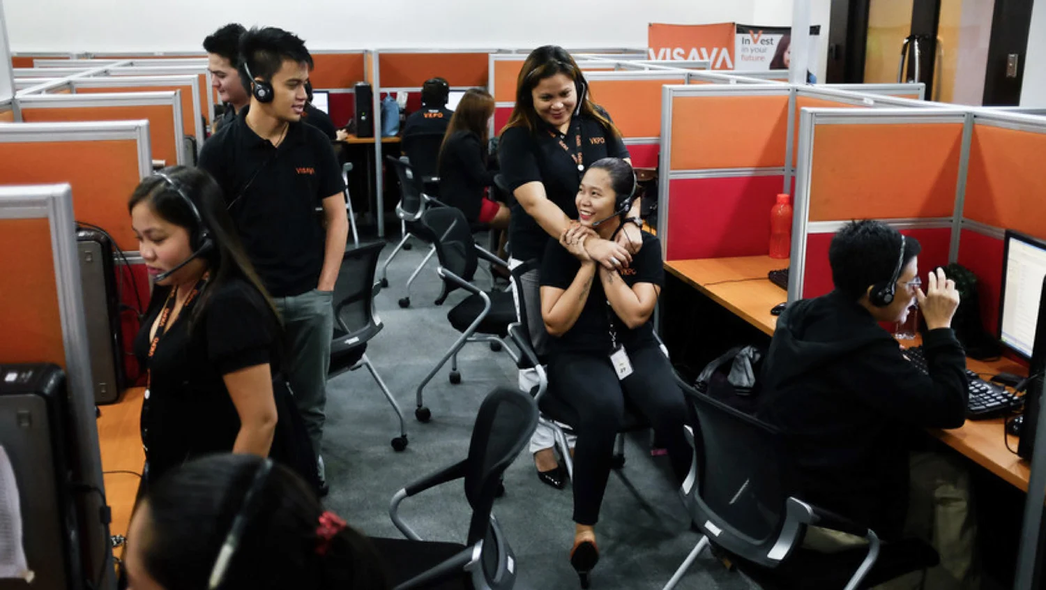 Young Filipinos enjoying a moment off at one of the numerous call centers--the new economic lifeblood, in the old country where “English-only” rules, rule. (Photo by Nacho Hernandez/Bloomberg Markets)