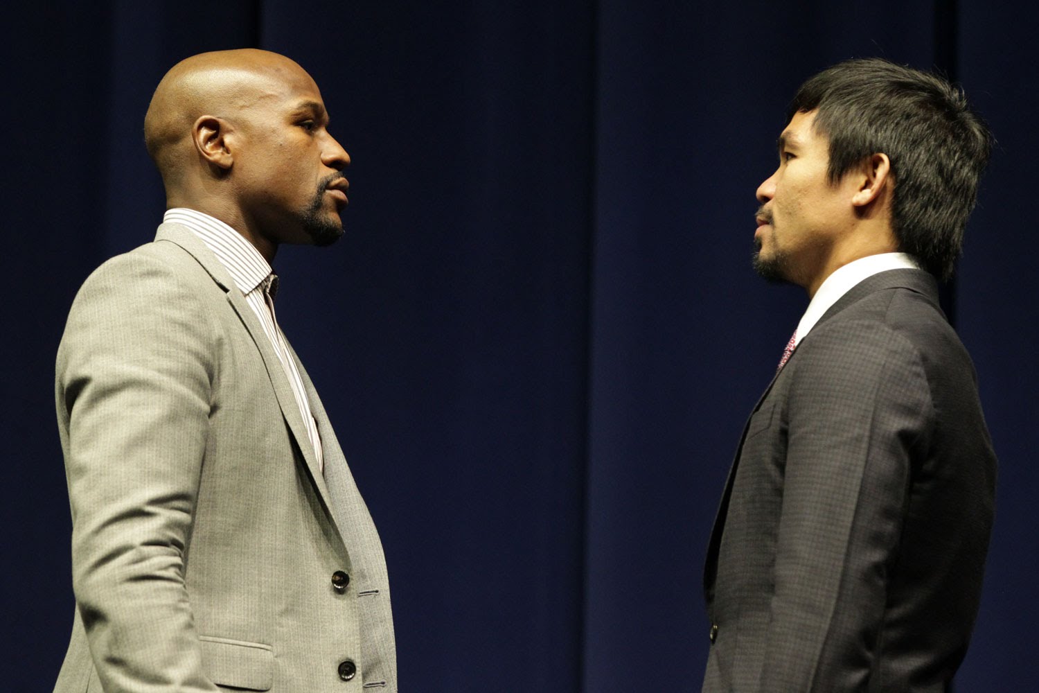 Floyd Mayweather, Jr. sizes up Manny Pacquiao during the press conference announcing the fight (Source: HBO)