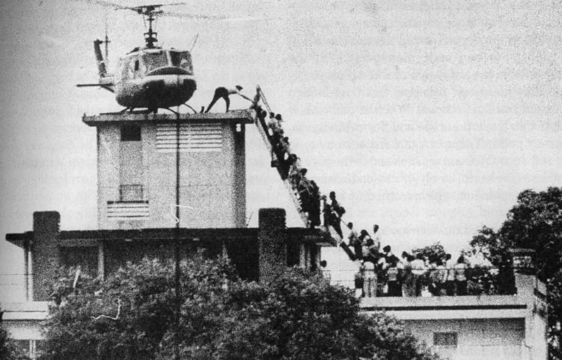 Forty years after the fall of Saigon, Ken Kashiwahara returned to the scene of the one of the most signature images from that historic day. The photo by Hubert van Es shows panicked South Vietnamese citizens hurrying up a ladder to grab one of the last seats aboard a US helicopter that could take them out of South Vietnam before the communist takeover.