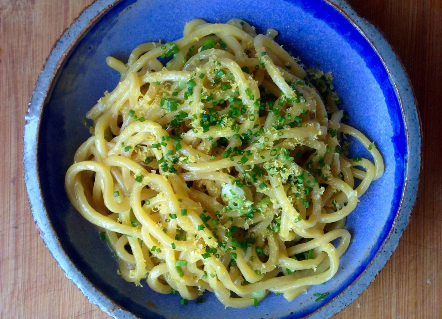 "Pancit" egg noodles, calamansi butter, scallions, chives and patis- cured egg yolk (Photo courtesy of LASA Restaurant Project)