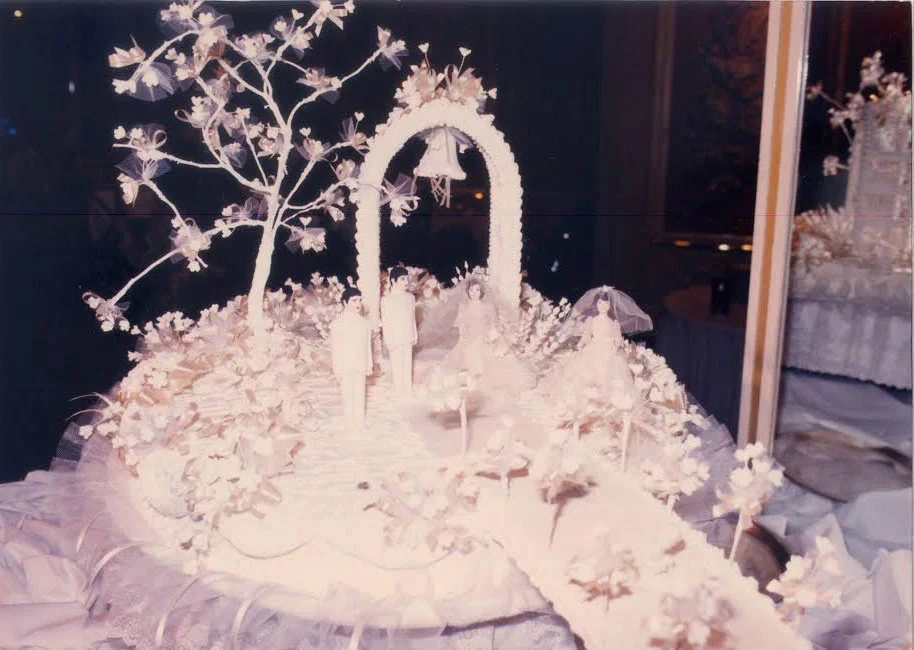 Gloria Y. Nichols' cakes from The Rolling Pin Bakeshop were famous for the handmade, intricate details like replicating the bride and groom's outfits and hundreds of little handcrafted flowers. (Photo provided by Maridel Menguito Anama from the Gloria Nichols' family albums)