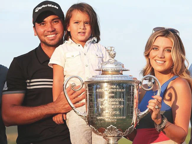 The Day family (Jason, son Dash, and wife Ellie) posing with the Wanamaker trophy of the PGA Championship (Source: Getty Images)