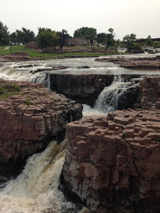 Sioux Falls, South Dakota is built around the natural waterfalls in its midst. A park has been created around this natural wonder so visitors can wander and wonder. (Photo by Irwin Ver)