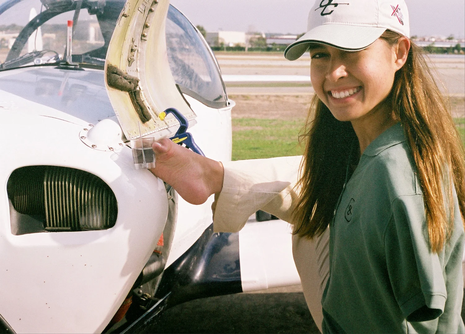 Jessica checking on her plane before take-off (Courtesy of Jessica Cox Motivational Services)