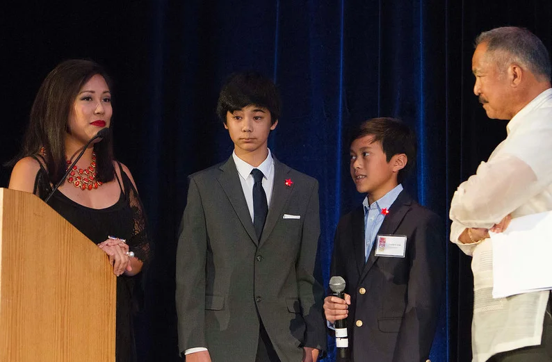 Young child sponsors DJ Maceda and Matthew Lim (2nd and 3rd from left), shared their experiences and gratitude with the audience. Hosts Keesa Ocampo, left, and Lloyd LaCuesta, right, flank the boys. (Photo by Noel Ferrer)