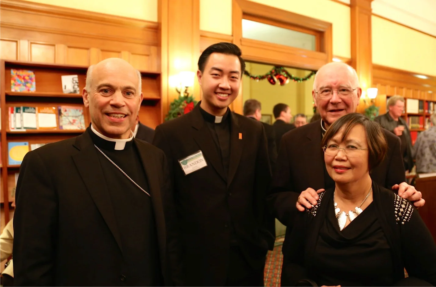 Current SF Archbishop Salvatore Cordileone, Seminarian Brandon Dang, Former Archbishop George Niederauer, and Nellie Hizon at the St. Patrick Seminary Christmas gather in 2014. (Photo by Seminarian Ernesto Jandonero)