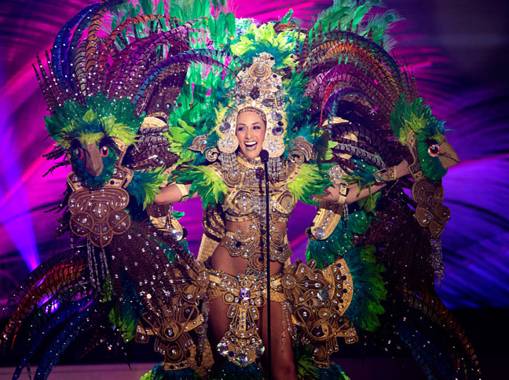 There must be a person in there, somewhere . . . The smaller the country, the larger the costume is, usually. Above, Miss Nicaragua-Universe 2015. No truth to the rumor that the delegates were required to take bird-feather desensitization shots. But even this humongous confection did not win the Best National Costume trophy. 