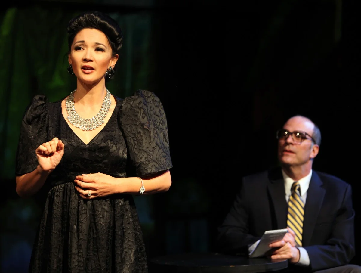 Imelda (Beverly Sotelo) is interviewed by Bob Stone (Lawrence Radecker) (Photo by Jennifer Reiley).