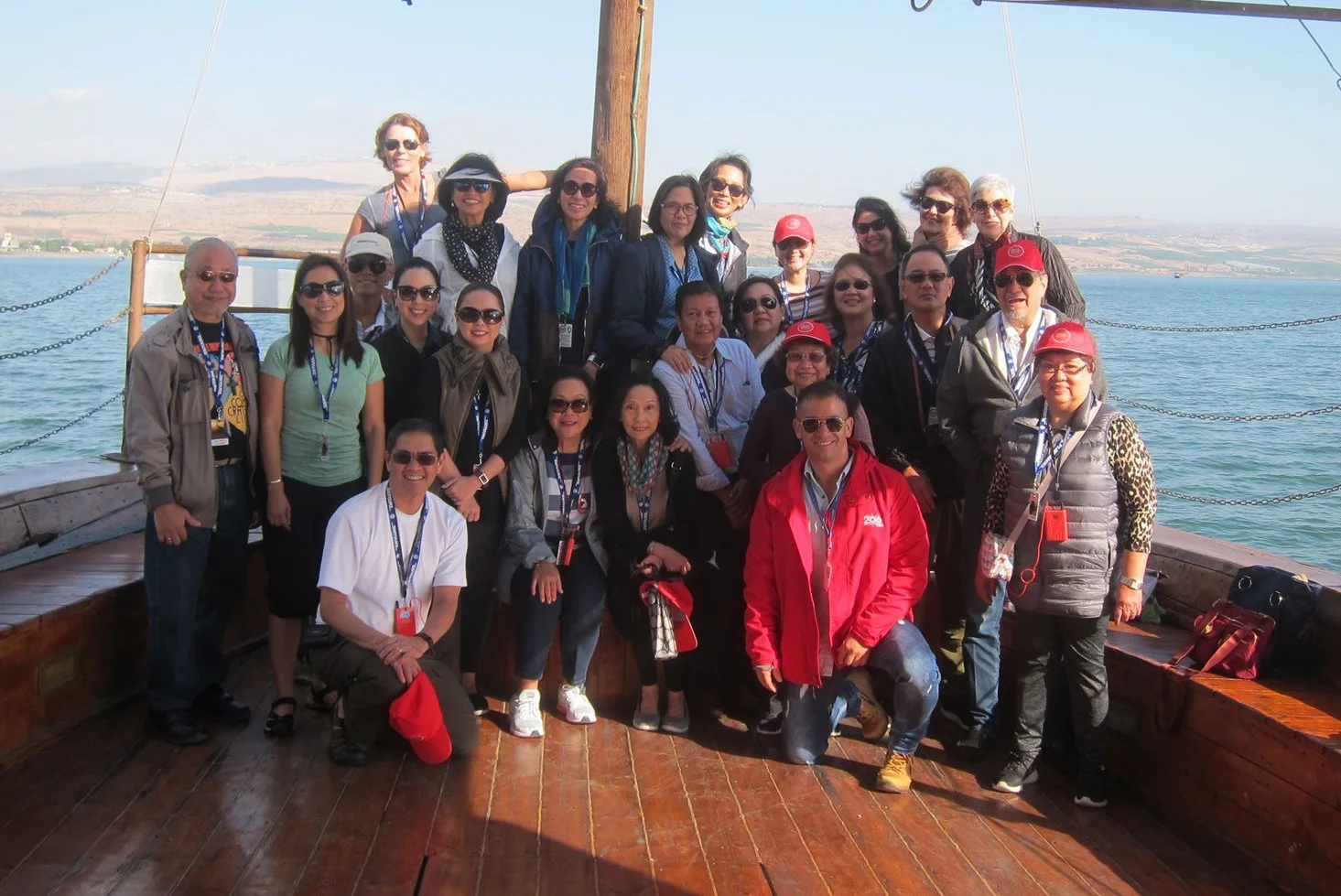 Members of the pilgrimage pose for a souvenir shot on the boat ride on the Sea of Galilee. 