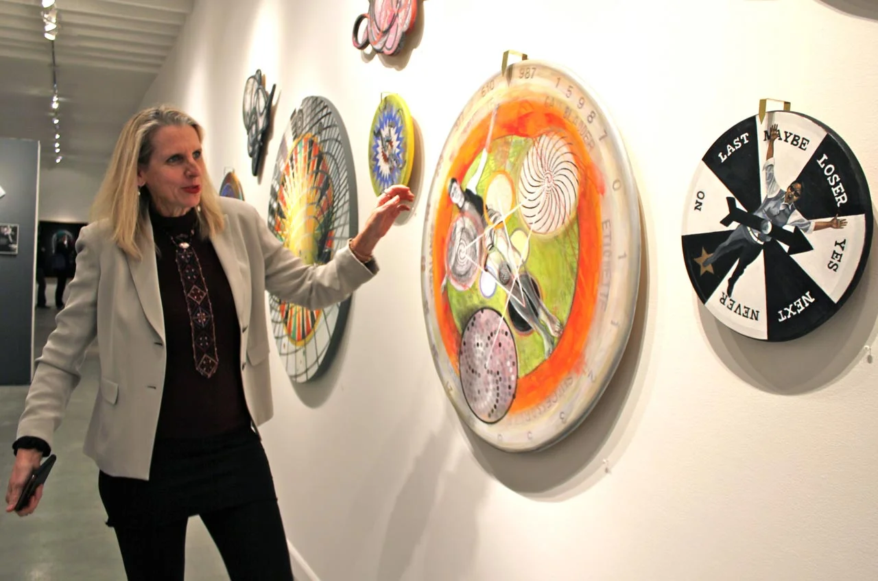 Johanna Poethig spins a piece at the opening of the Positional Vertigo exhibition. Filipino American imagery is both overt and subtle in her work, as in the inclusion of the words “Gall Bladder” on the wheel (below numbers 15987). Poethig revealed that this refers to a Philippine tribe that gives equivalent importance and mythic status to that organ as we do to the heart. (Photo © France Viana)