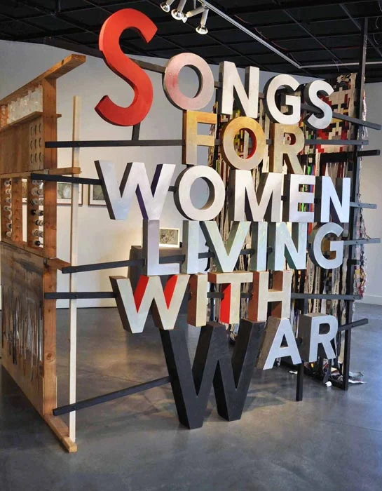 Bahay ni Lola by Johanna Poethig at the Songs of Women Living With War exhibition, Pro Arts, Oakland, 2016. Artworks graphically and viscerally narrate struggles and include a video of a “comfort woman” reacting to the newly installed plaque in Manila commemorating their WWII role during the Japanese occupation, conceptual pieces and sound art. (Photo © Johanna Poethig)