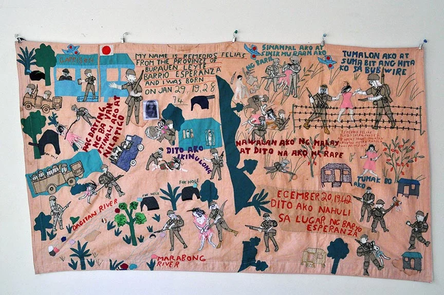 Lola Remedios, quilt, at the Songs of Women Living With War exhibition, collection of M. Evelina Galang. ( Photo © Johanna Poethig)