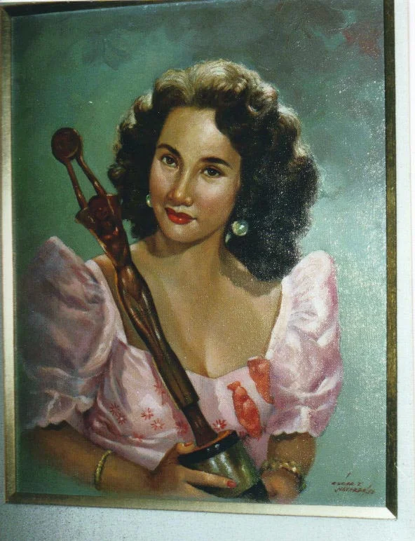 A painting of Carol Varga in a Ruben Panis terno holding her FAMAS statuette for her supporting role inGuapo (Handsome). (Photo is courtesy of Carol Varga)