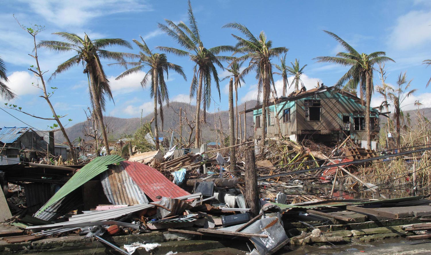 Destruction caused by Typhoon Haiyan in Tacloban, Philippines, 2013 (Photo by Henri Donati/Department for International Development, UK)