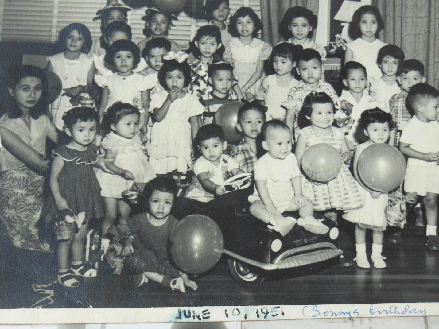 My birthday party, age two. Lolo gave me a big red push-pedal fire truck