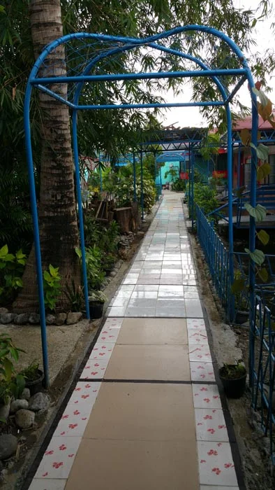Path of tiles that leads to my eldest brother Joe's housing project.(Photo by Patria Rivera)