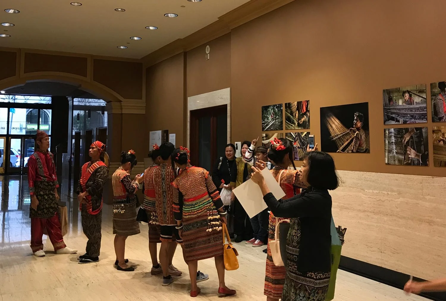 Mandaya,T'boli view photographs of their weavers at the Mills Building exhibit (Photo by Michael Gonzalez)