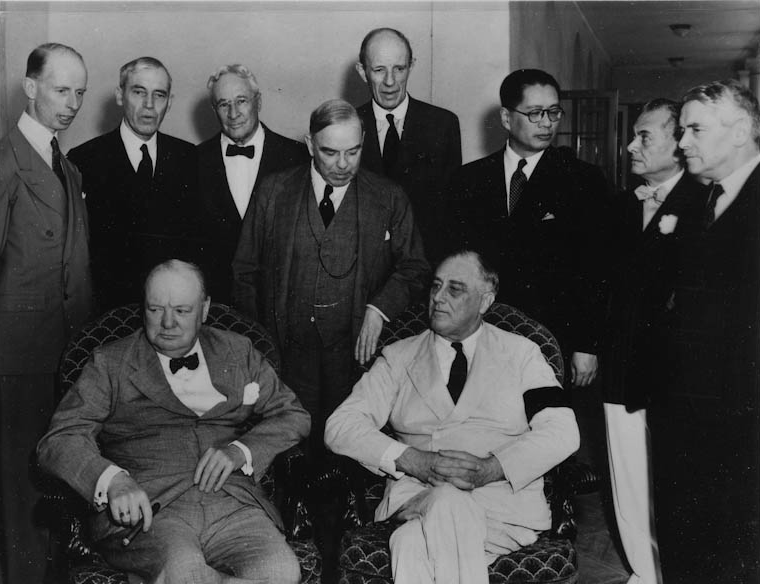 Franklin D. Roosevelt and Winston Churchill with (standing from left to right) Leighton McCarthy, Van Kleffens, Sid Owen-Dixon, MacKenzie King, Lord Halifax, T.V. Soong, President Quezon, and Walter Nash for the Pacific War Council in Washington, D.…
