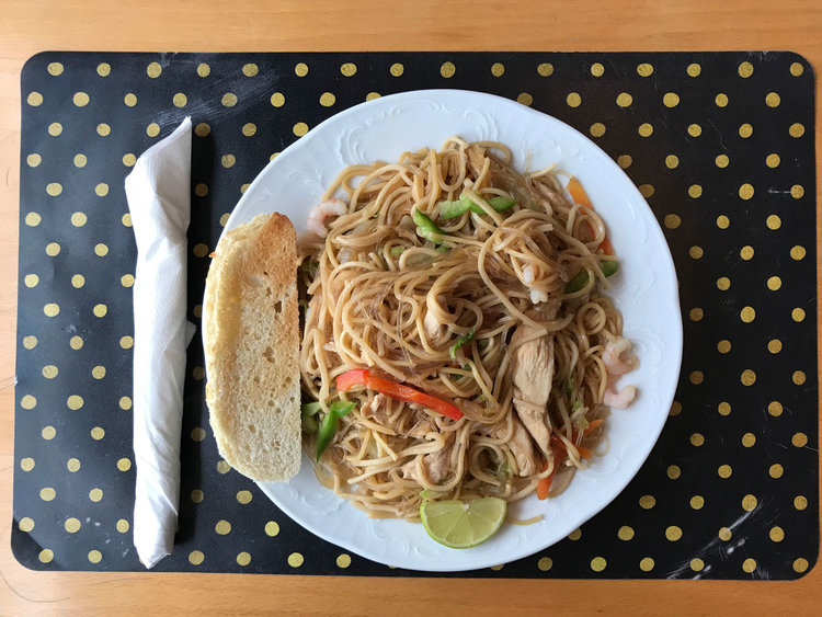 Matstofan's pancit canton, served with a side of white bread. 