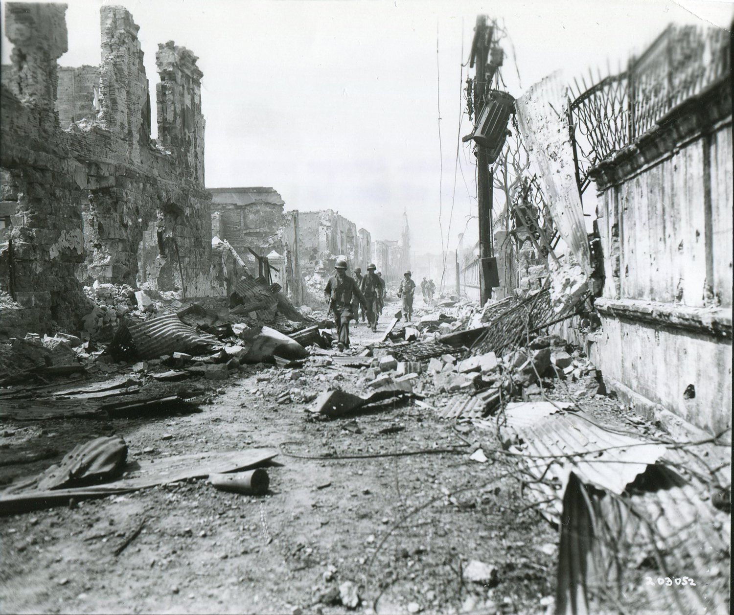 A platoon of American troops move into the Walled City on February 23, 1945. (National Archives)