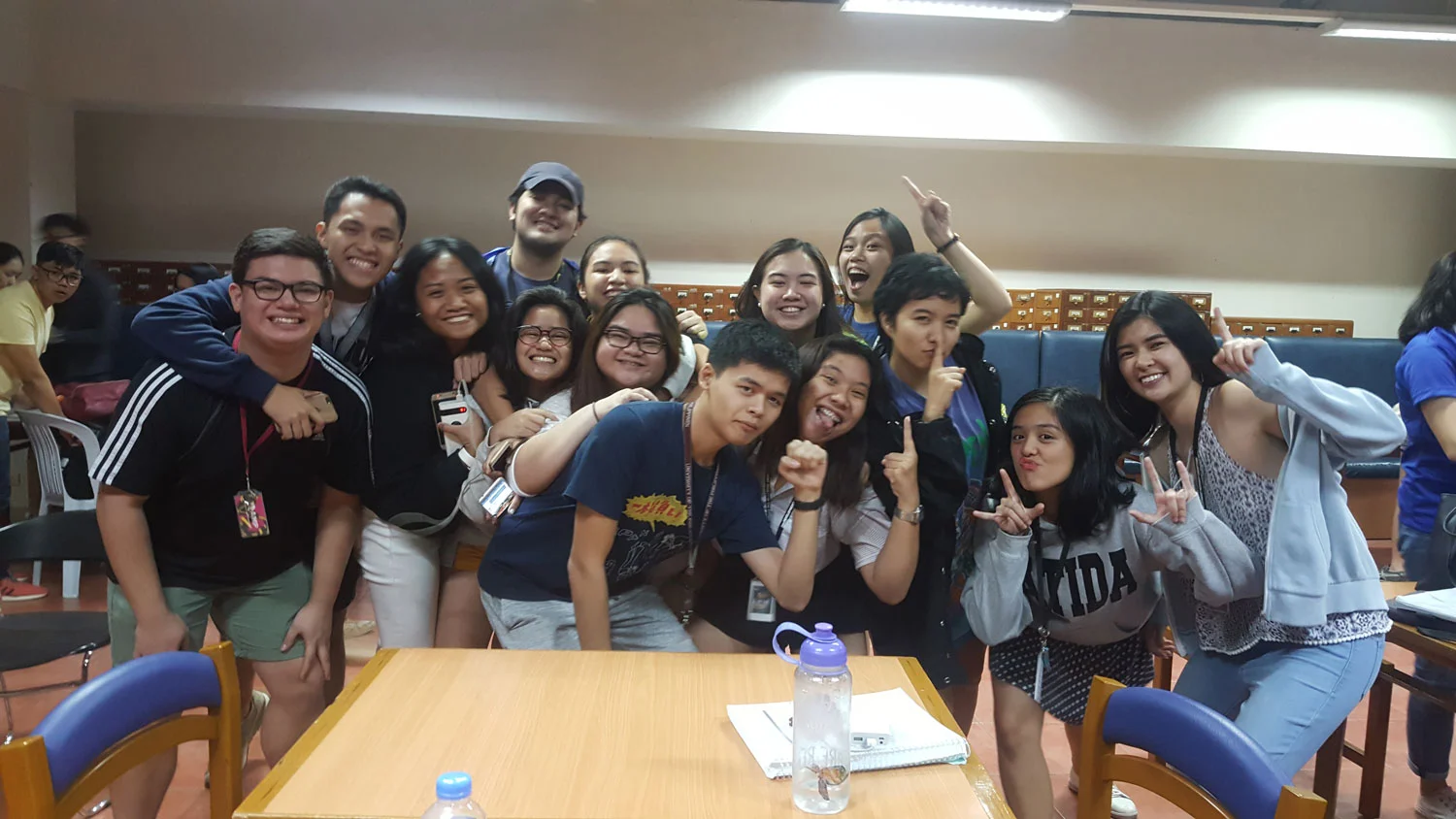 12 years later, December 2018, Maia (extreme right) celebrates with schoolmates after Ateneo wins the championship.