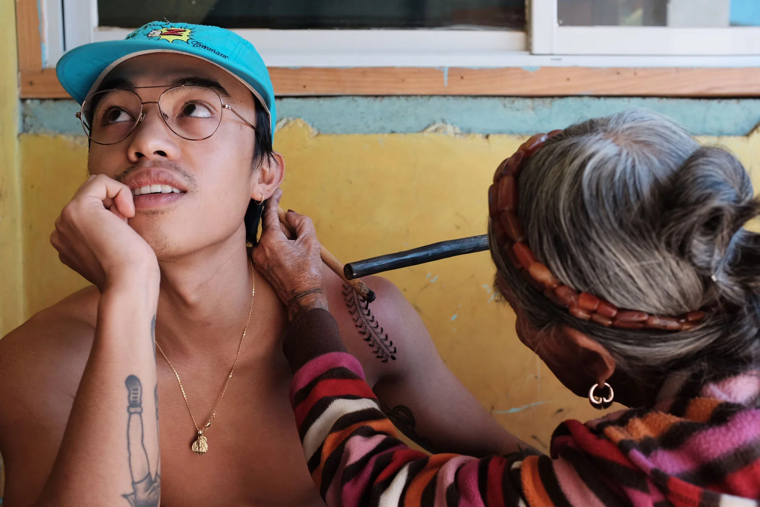 Jensen got the increasingly rare honor to be tattooed by Whang Od herself. She took two hours to complete a centipede design (Photo by Maia Almendral Esteves).