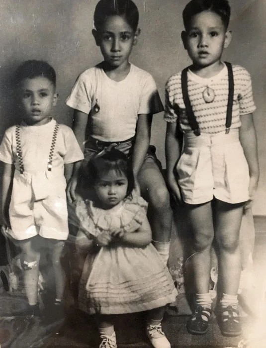 The Peñaranda siblings with a cousin (the small boy on the left). The author is on the right, elder brother Gil is in the middle.