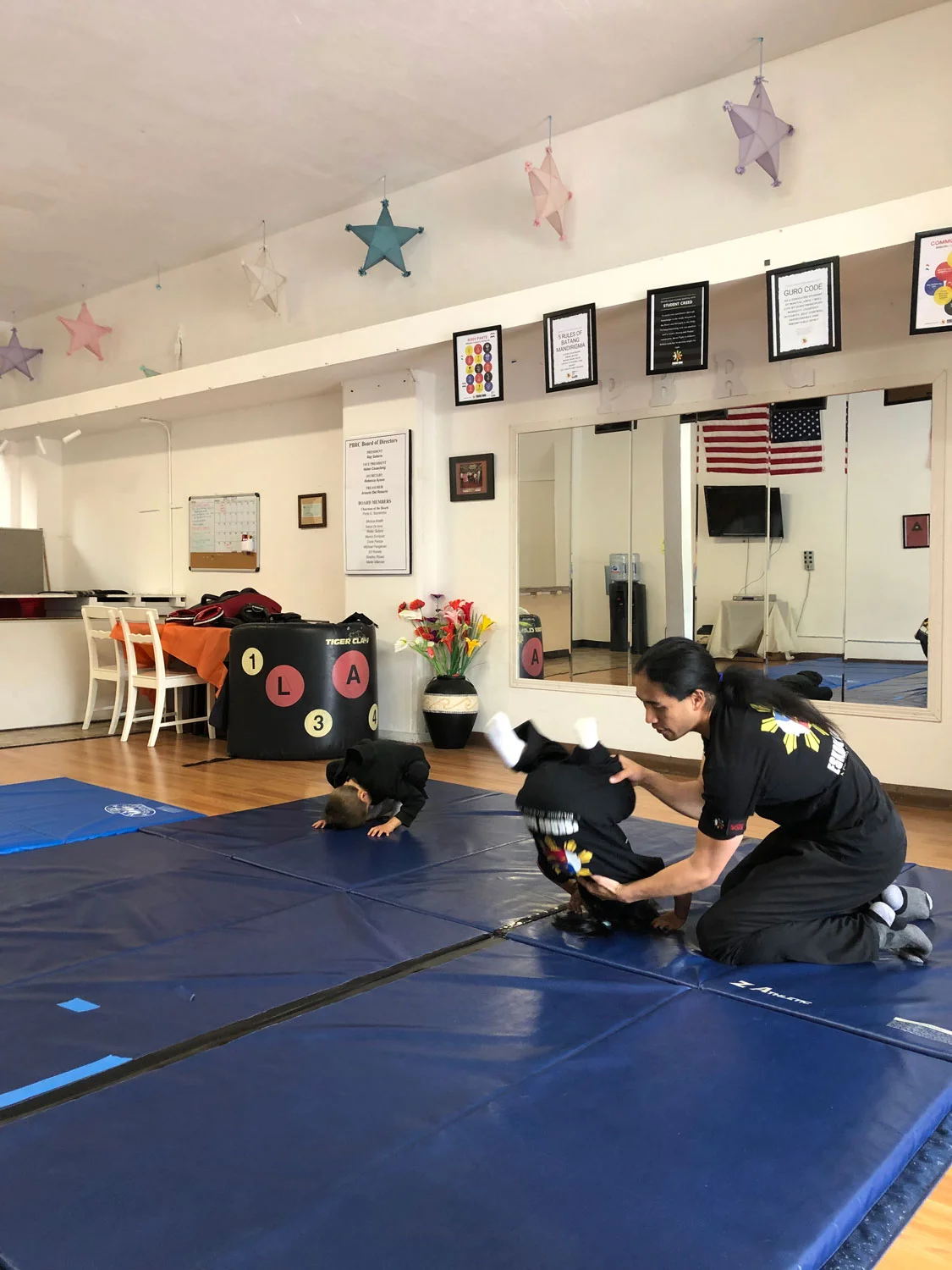 Guro Joseph teaches a little warrior how to roll safely.