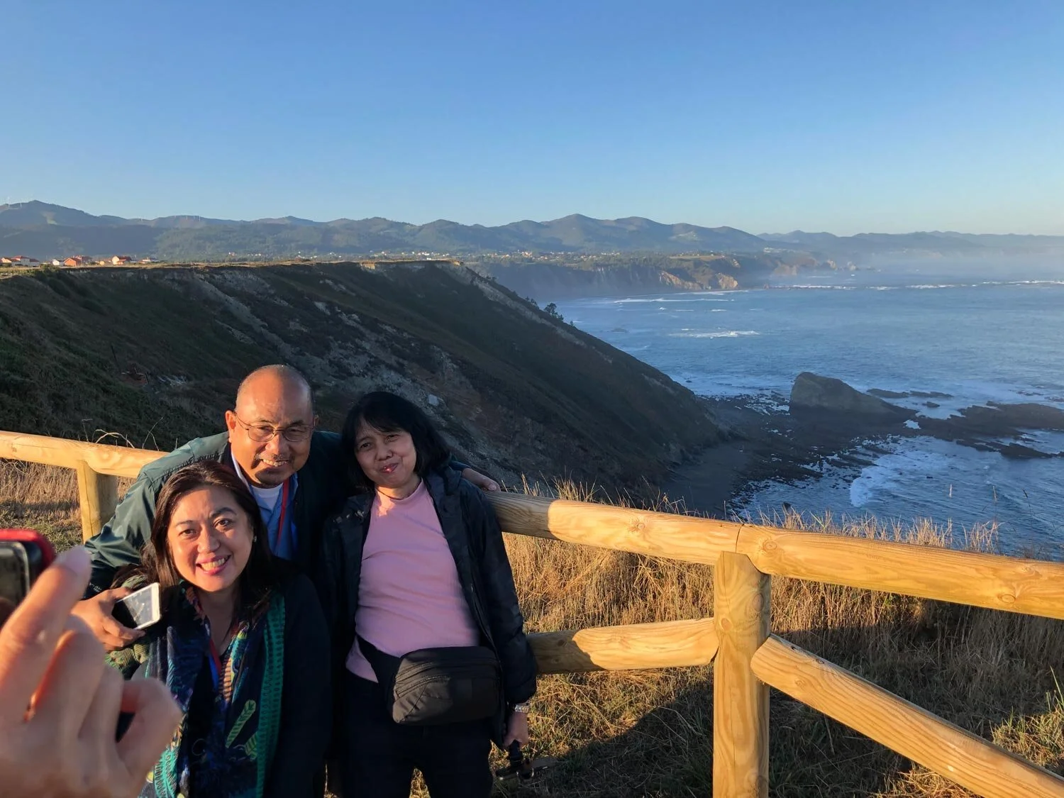 Philippines-based doctors Mavic and Raf Vasquez and Mariles Valte enjoy the breeze at Finisterre, the northernmost tip of Spain. (Photo by Cherie M. Querol Moreno)