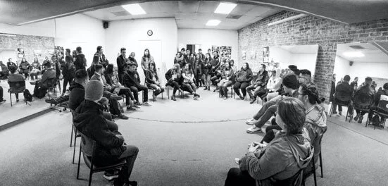 Ethnic Studies students from Sacramento State University on a field trip to Little Manila historic district. College students from Berkeley, San Francisco State University, UC Davis, UCLA, CSU East Bay, and other colleges and universities in California often come on field trips to visit Little Manila. Lang Luntao, Little Manila Rising board of directors member, is giving the students an orientation. (Photo by James Sobredo)