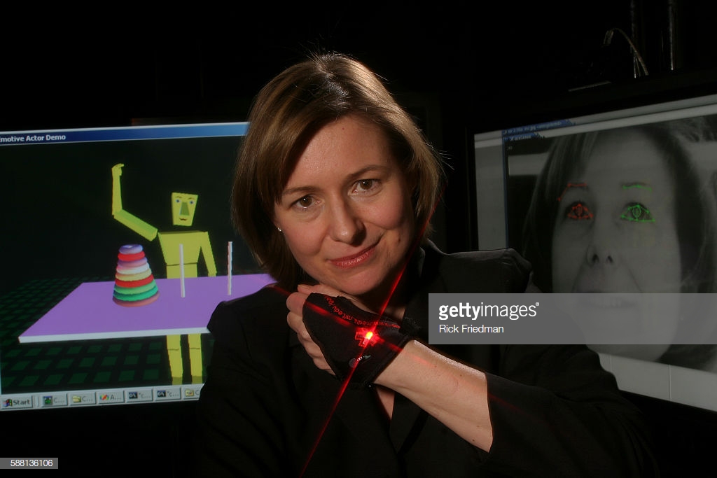 This is Dr. Picard wearing "The Galvactivator" which senses skin conductivity and stress on the palms and connects it to an LED light that glows when the wearer is excited or thinking significant thoughts.
