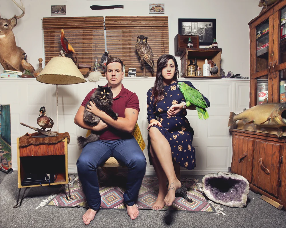 magida's sister, yasmine + tyler, with tasha the cat and jade the parrot.