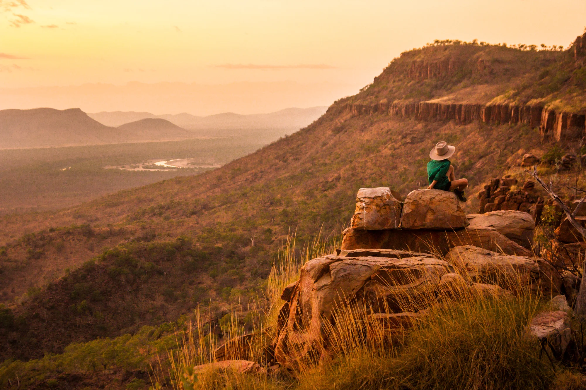 Ned Alexander soaking in the terrain that has become his home. A view from House Roof Hill looking over a bend in the Ord River. After their season managing Carlton Hill Station, the Alexanders returned to Queensland to manage a new business and keep the family closer together.