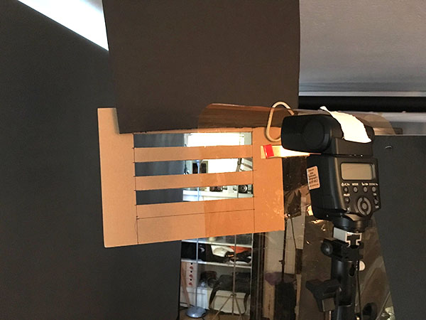 Home-made cardboard gobo to create the projection on the background via the speedlight. In the photos of Rick Sammon I had one of these on each side of the set.