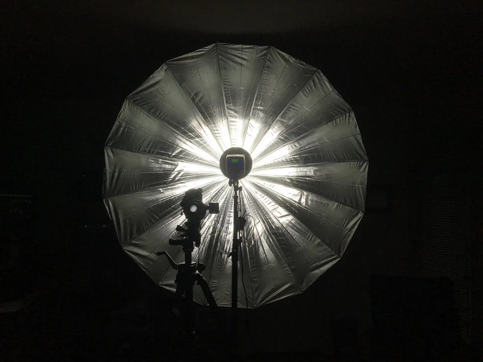 Flash head mounted far down the shaft of the umbrella